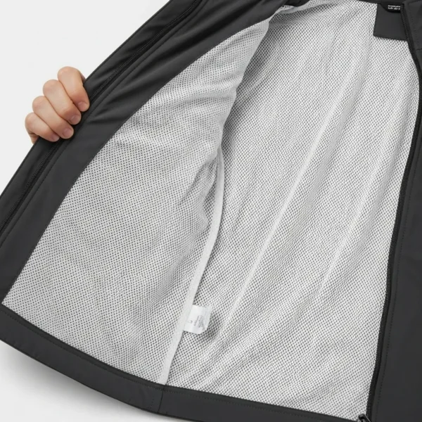 Interior view of a jacket showing the lightweight, breathable white polyester mesh lining often used for moisture-wicking and ventilation.